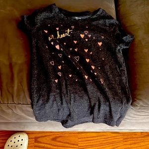 I’m selling a black t shirt with pink hearts